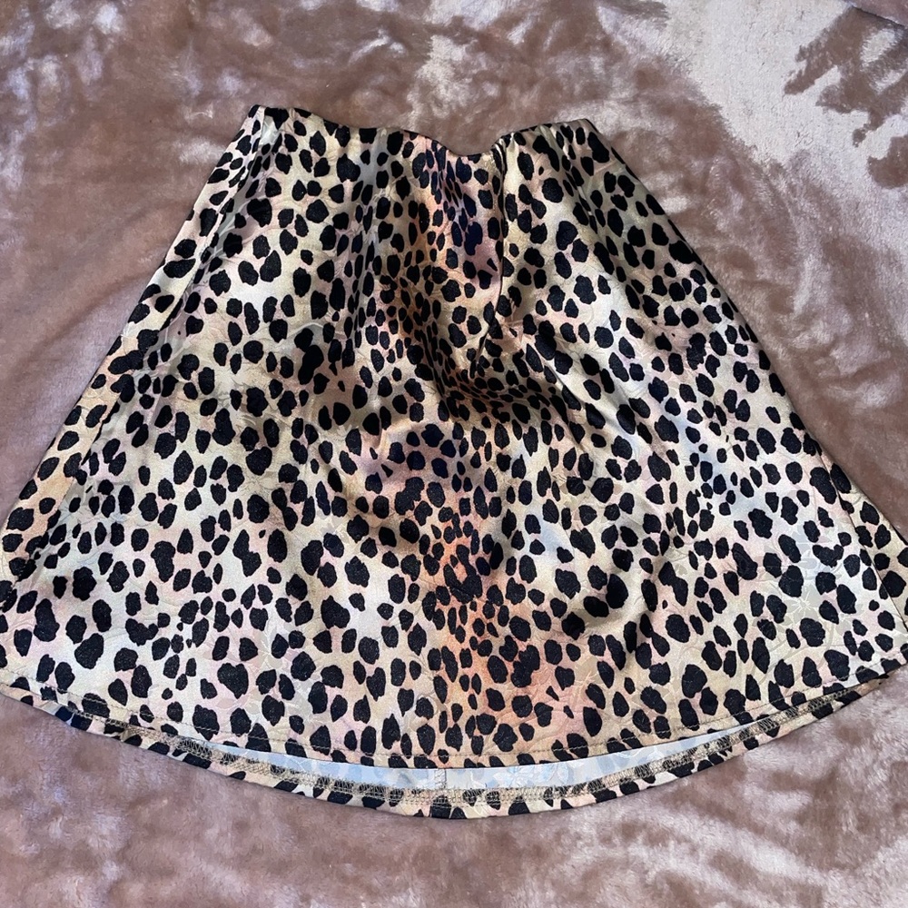 Princess Polly cheetah skirt with floral background